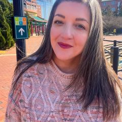 Photo of ERT Assistant Director Kaycee J. McCoy with the Pagoda in Downtown Norfolk in the background